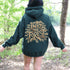 Featuring the phrase "Into the Forest" uniquely crafted in tree branch lettering, this design brings the beauty and mystery of the woods to life.
